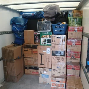 Neatly stacked moving boxes and household items securely packed inside a Swift Umzug Berlin moving truck